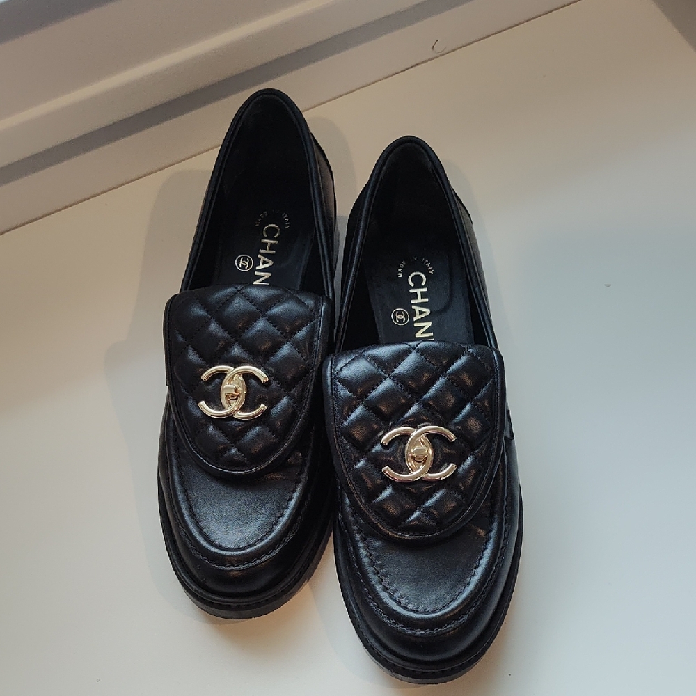 CHANEL Black Quilted Loafers with Gold Emblem